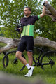 HOLOKOLO Tricoul și pantaloni scurți de ciclism - OPTIMISTIC ELITE - negru/verde